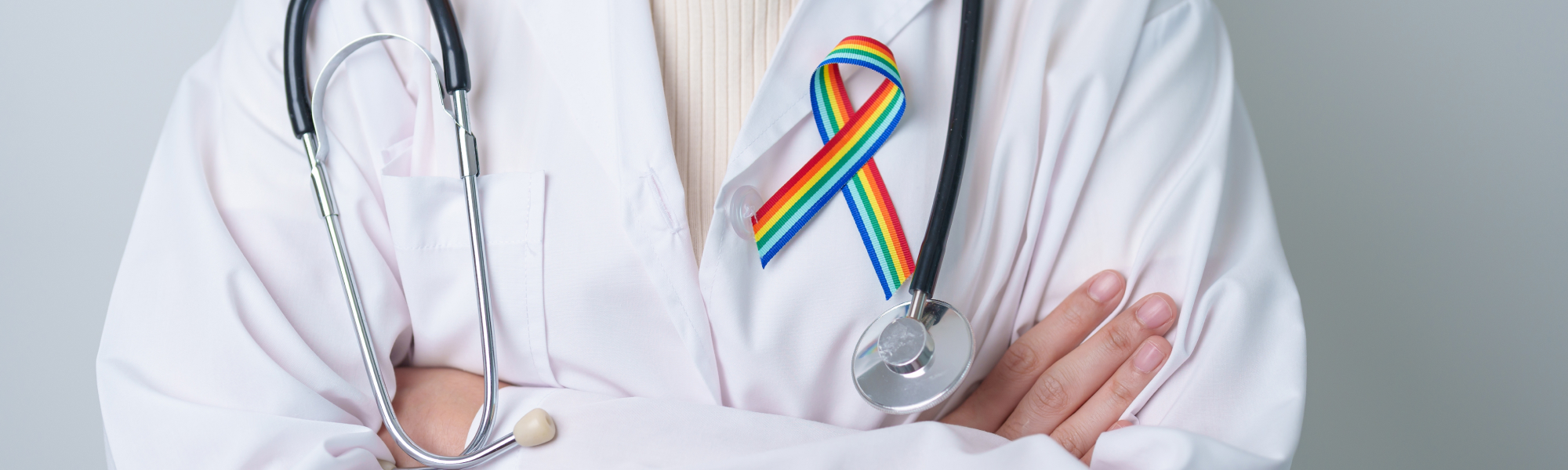 pharmacist with rainbow ribbon pin on their lab coat