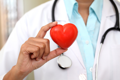 doctor holding red love heart